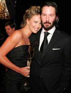 Keanu Charles Reeves with his girlfriend Charlize