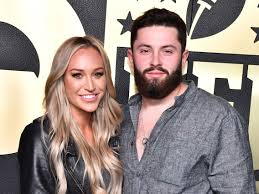 Baker Mayfield with his wife