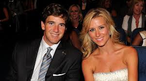 Eli Manning with his wife