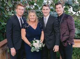 Tyler Cameron with his mother & brothers