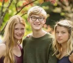 Rory John Gates with his sisters