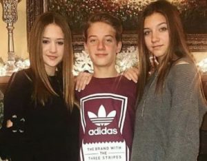 Mads Lewis with her brother & sister