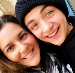 Asher Angel with his mother