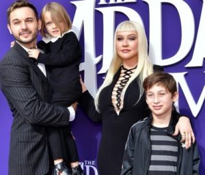 Mathew Rutler with his wife & children