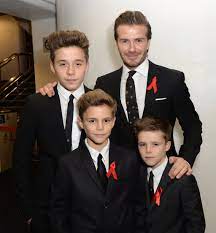 Brooklyn Beckham with his father & brothers