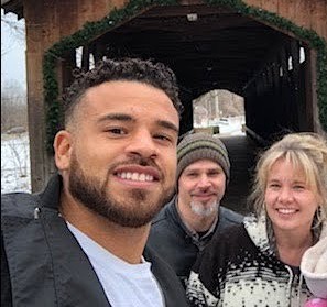 Cory Wharton with his parents