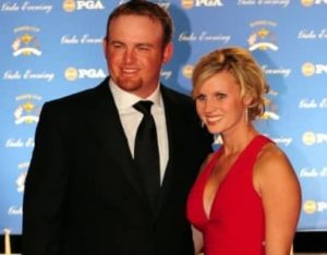 J. B. Holmes with his wife