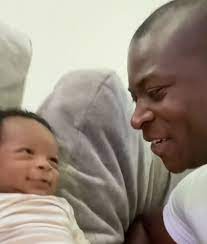 O.T. Genasis with his son