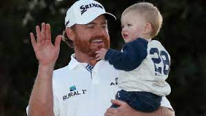 J. B. Holmes with his son