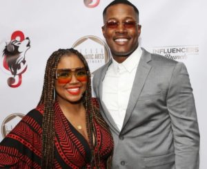 Flex Alexander with his wife