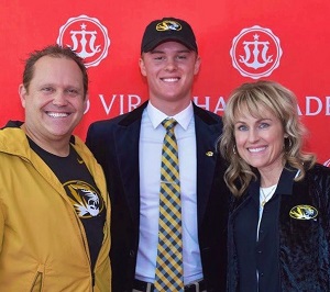 Brady Cook with his parents