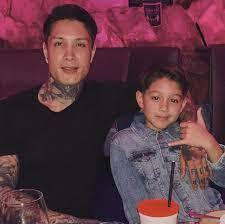 Chris Heria with his son